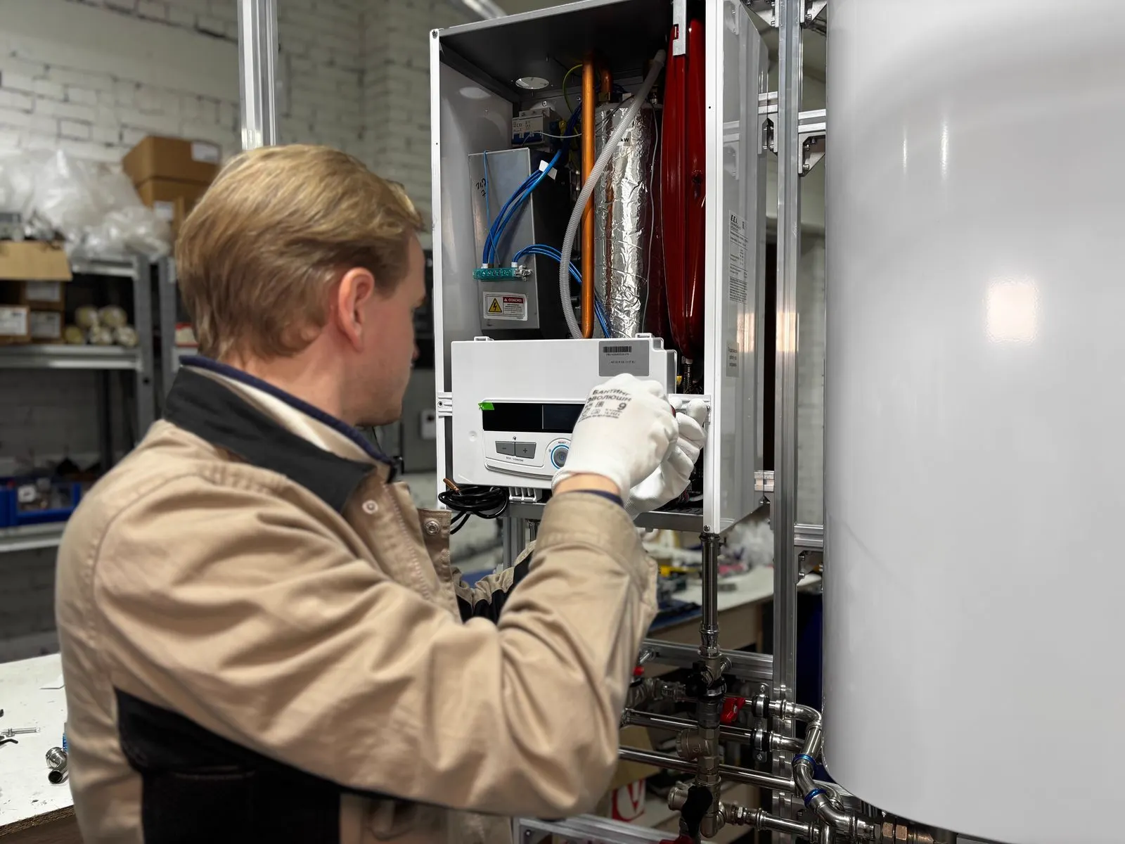 Commercial plumbing technicians servicing pipes and valves in a mechanical room